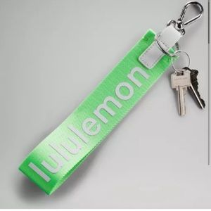 RARE NWOT Lululemon Never lost keychain in Scream Green